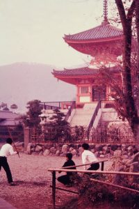 boys-playing-stickball-near-temple-pagoda-japan